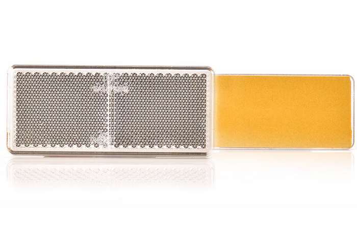 Odsevna naprava 96 x 42 mm spredaj s samolepilnim trakom